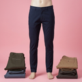 Navy chino trousers on a lower-body mannequin with olive, blue-grey, tan and dark grey trousers arranged at the sides
