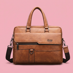 Brown briefcase shoulder bag on a soft pink background