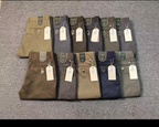 Assorted men's khaki pants in neutral colours, sold individually