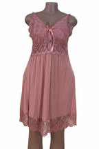 Pink lace dress close-up on white background