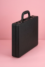Angled view of black briefcase showing handle and locks